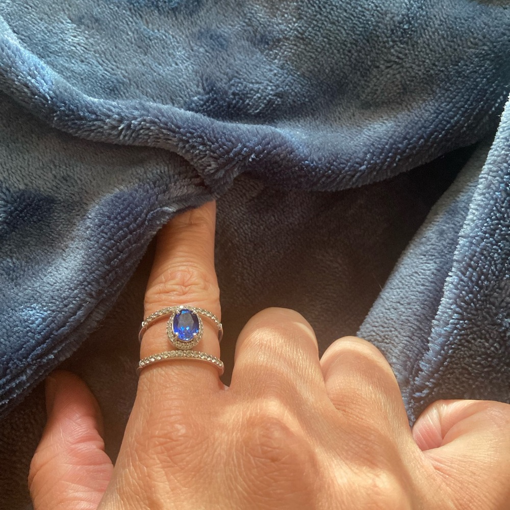 Sterling silver, factory-produced sapphire ring.